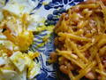 closeup beans on toast with egg
