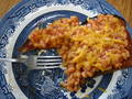 partially eaten beans on toast